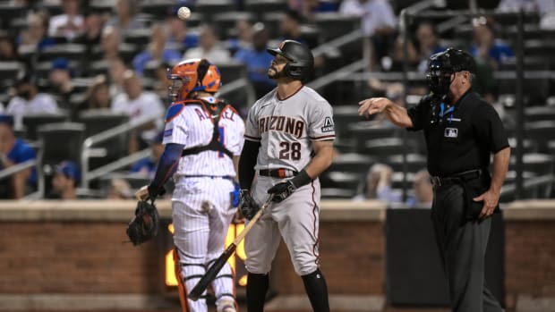 Diamondbacks designated hitter Tommy Pham (28) reacts after striking out to end the first inning.
